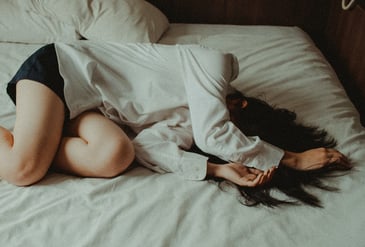 a girl with ADHD laying on the bed