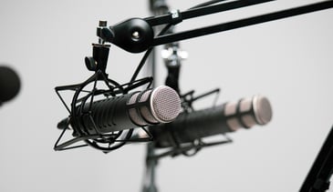 multiple microphones set up in a studio