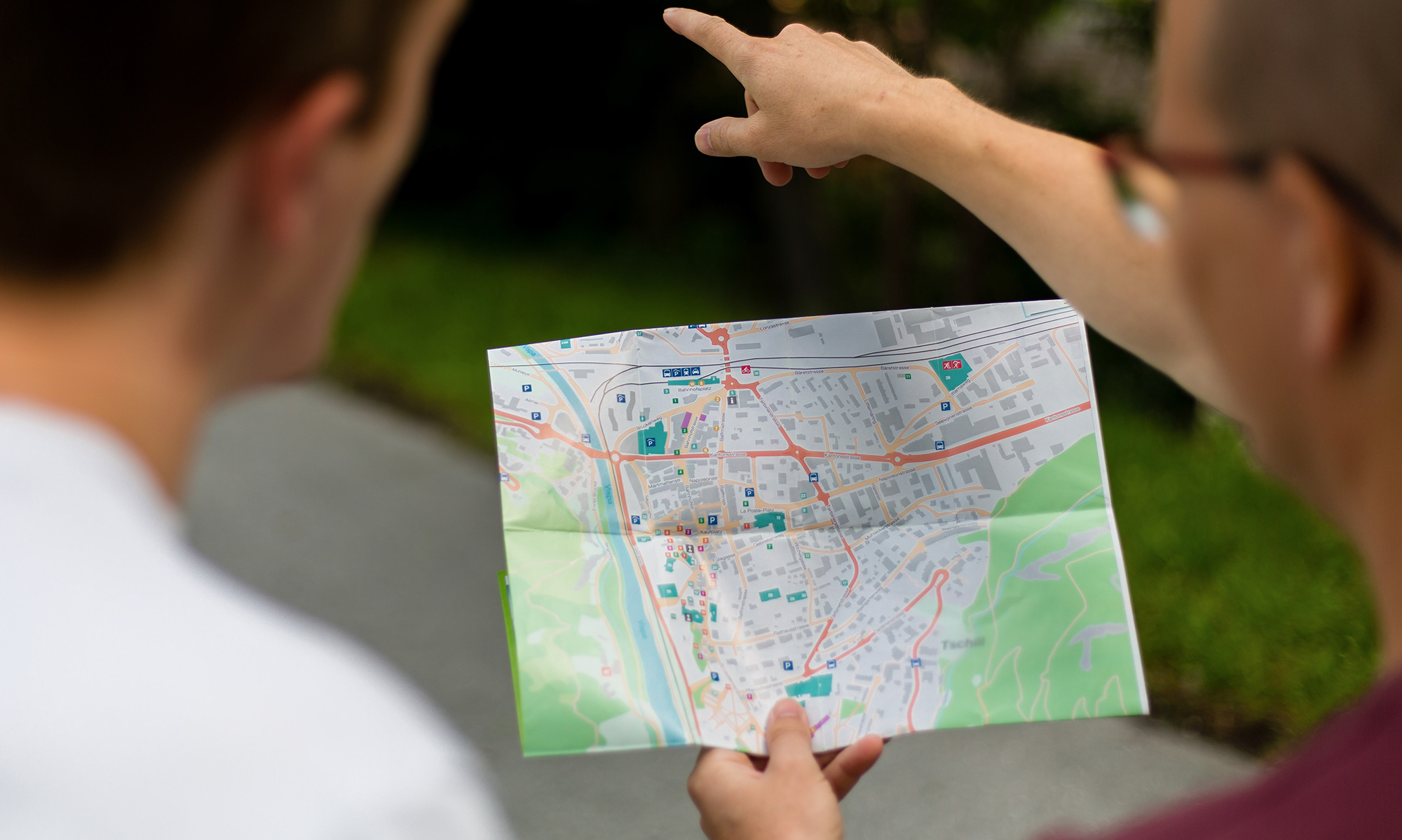 two people looking at a map