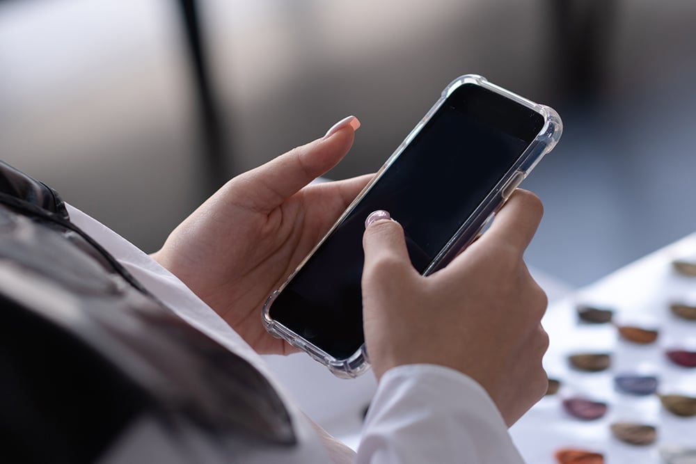 a person holding a mobile phone